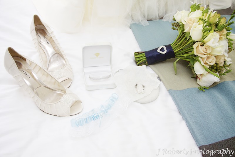 Brides accessories laid out on a bed - wedding photography sydney